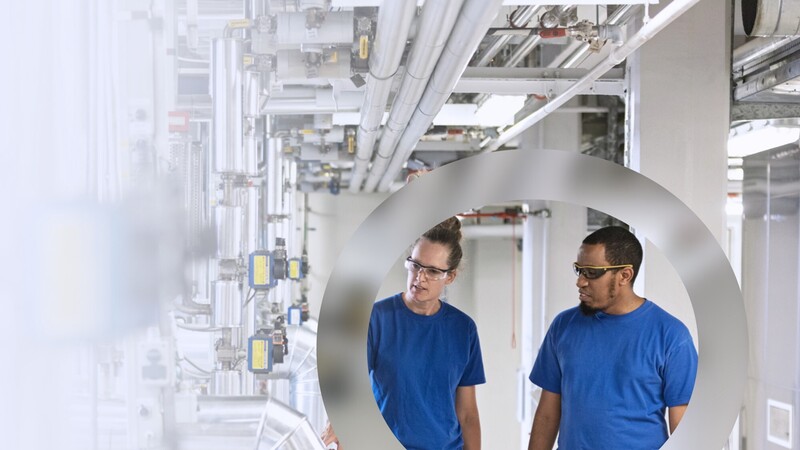 Production colleagues inspecting equipment